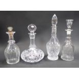 Four cut glass decanters, to include an Edinburgh Crystal ships decanter and stopper, 27cm high, a m