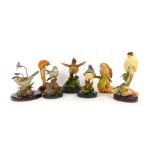 A group of Country Artists figures, comprising green woodpecker on ivy, Nuthatch, Royal Doulton wren