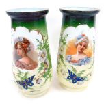 A pair of Victorian milk glass vases, of cylindrical tapering form, each decorated with a head and s