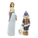Two Lladro figures, comprising a young boy in winter coat with Polar Bear, 14cm high, and a lady in
