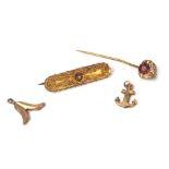 A 10ct gold bar brooch, with scroll applique design, 4cm wide, a paste stone set and gilt metal stic