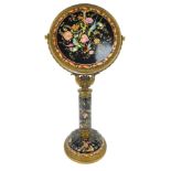 A European style oriental and porcelain dressing table mirror, the circular top with a fluted border