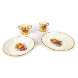 Four items of Royal Worcester blush ivory, comprising two Fruits of the Bloom pin dishes, 10cm and 8