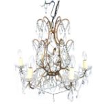 A wrought and cast metal chandelier, with cut and moulded glass centre, branches suspended by shaped