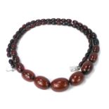 A cherry amber graduated necklace, with oblong beads, on string strand with plated clasp, set with p