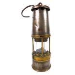 A Wolf miners lamp, by The Wolf Safety Lamp Company Sheffield, No MBS, with swing handle, 28cm high.