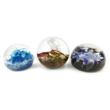 Three glass paperweights, comprising Volcano, Caithness Diamond Blue 295/500, Caithness Spindrift 24