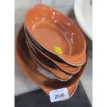 A set of Denby brown treacle glazed tureen dishes, one large and four small. (5)