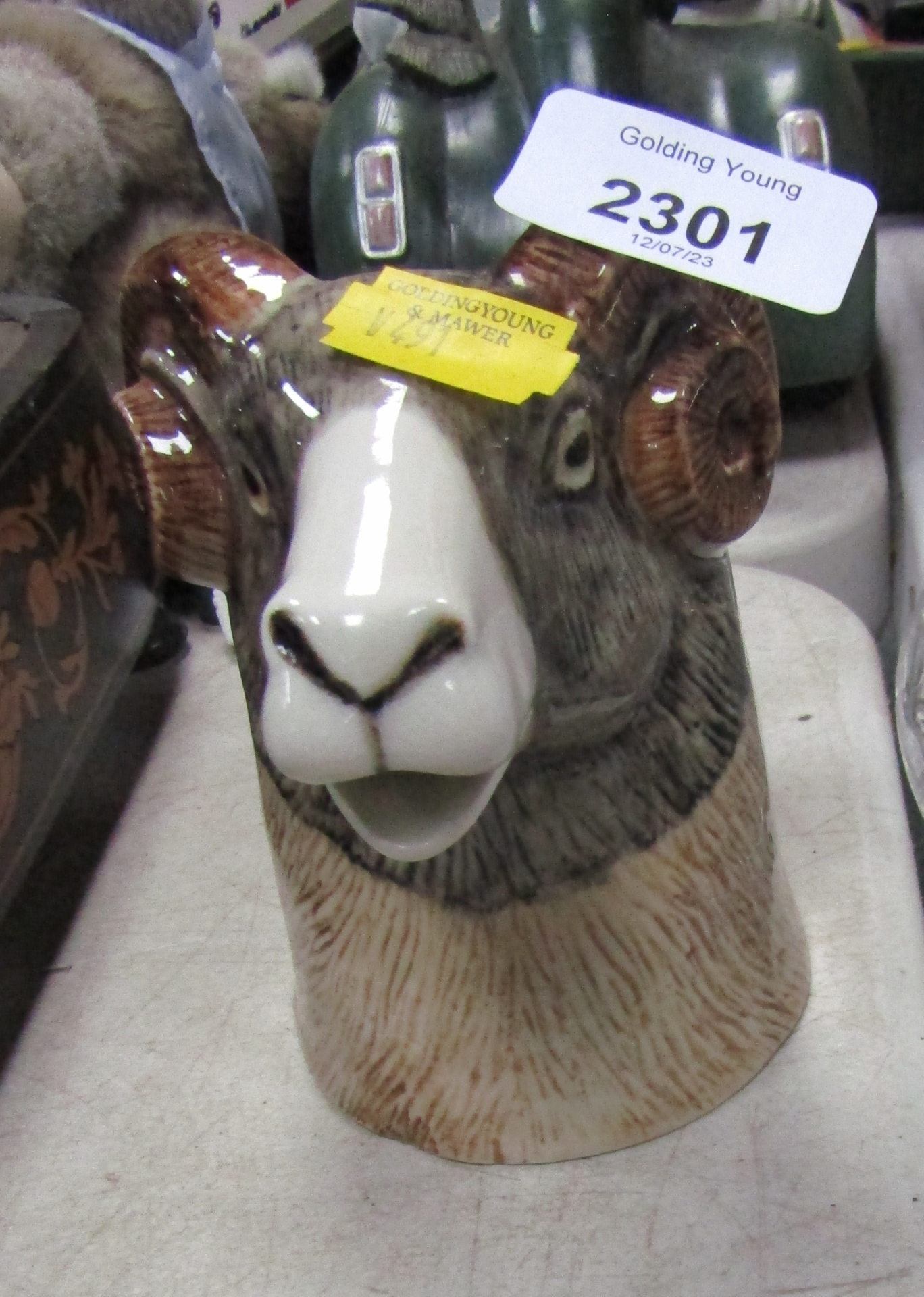 A Quail pottery jug modelled as a goat, 12cm high.