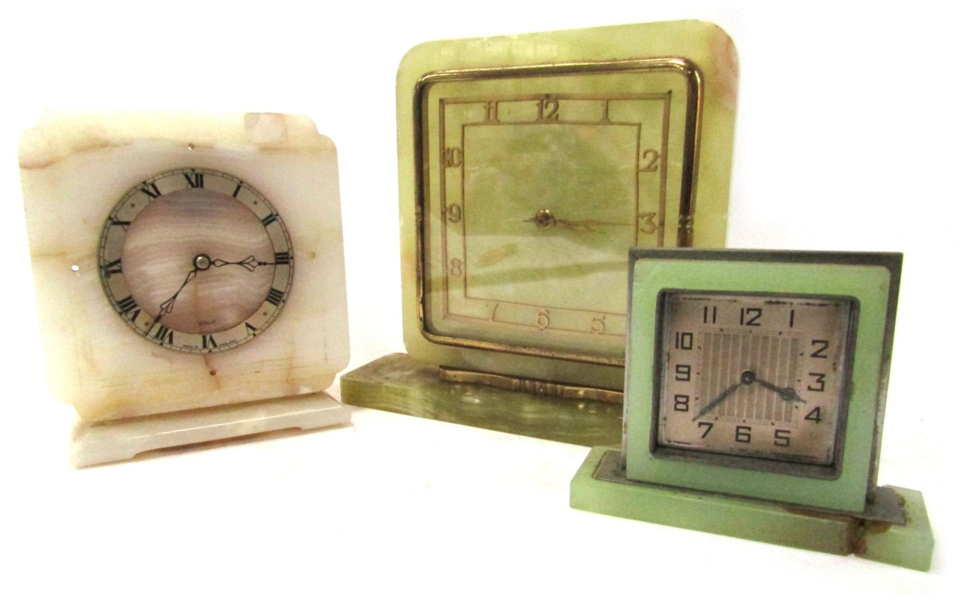 Three Art Deco style onyx mantel clocks, comprising a green onyx rectangular faces mantel clock, wit