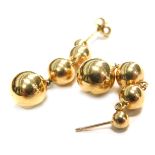 A pair of 9ct gold drop earrings, the four tiered ball drop designs on single pin back, lacking butt