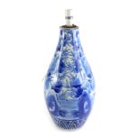 A late 19thC Japanese blue and white bottle shaped porcelain vase, decorated with buildings, etc., r