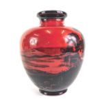A Royal Doulton Flambe vase, decorated with an extensive rural landscape with cottages, etc., printe