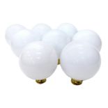 Eight Christopher Wray globe opaque glass ceiling lights, with brass hangings, 31cm high.