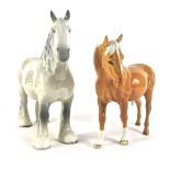 Two Beswick horses, comprising a grey mare, 21cm high, and a tan horse, 16cm high. (2)
