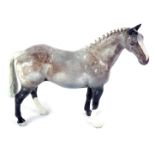 A Beswick dappled Welsh horse, with crest stamp.