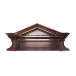 A walnut door pediment, the arched top with reeded columns, 111cm wide, 50cm deep.