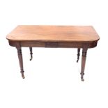 A 19thC mahogany demi lune table, with rounded corners, and reeded and tapering legs terminating in