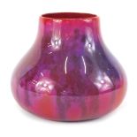 A Royal Doulton Flambe gourd shaped vase, with purple, pink and red mottled glazed, stamped to under