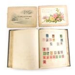 A stamp album, in original canvas case, a personal watercolour painted Christmas card dated 1900 To