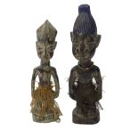 A pair of Yaruba Ibedi male and female African tribal protection figures, 36cm high.