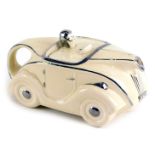 A 1920s cream and silvered Art Deco novelty car shaped teapot, 22cm wide.