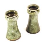 A pair of Royal Doulton stoneware tulip shaped vases, each with a mottled green glaze, impressed mar