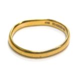A 22ct gold wedding band, of plain design, misshapen, ring size L½, 2.6g.