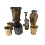 A group of metal wares, comprising a pair of brass candlesticks, brass mortars, a pewter money box,