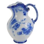 A Royal Doulton Shirley Poppies Art Nouveau style blue and white jug, 32cm high.