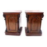 A pair of Victorian mahogany cabinets, each with a square top with rounded corners, with applied scr