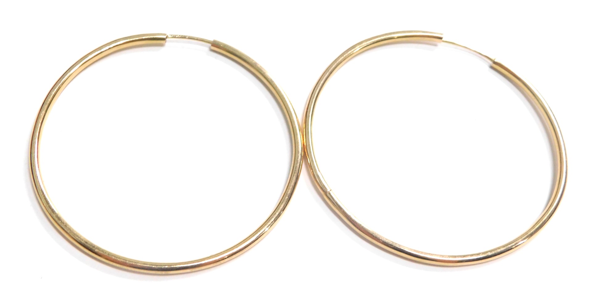 A pair of hoop earrings, yellow metal stamped 375, 6cm diameter, 8.7g.