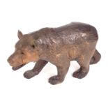 A Black Forest style bear, prowling, 15cm high.