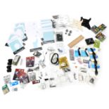 A quantity of guitar accessories, to include domo face guards, guitar polish kits, head stands, etc.