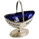 A George III silver sugar basket, with swing handle and pierced design body, with vacant cartouche,