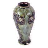 A Royal Doulton stoneware bullet shaped vase, decorated with flowers, scrolls, and leaves, in Art No