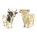Two Beswick bulls, comprising an Ayrshire and a Charolais, 12cm high. (2)