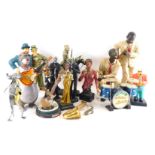 A collection of resin figures, to include Laurel and Hardy, a saxophonist figure on horseback, etc.