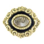 A Victorian memorial brooch, with brass outer border and central memorial panel, with black enamel a