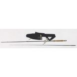A Hardy Brothers 9ft two piece split cane fibre fishing rod, with cork end, in material case.