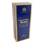 A bottle of Johnnie Walker blue label Scotch whisky, in original box and packaging.