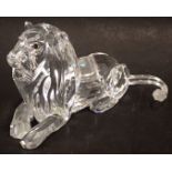 A Swarovski crystal Fabulous Creatures seated lion figure, with amber glass eyes, 6cm high, boxed.