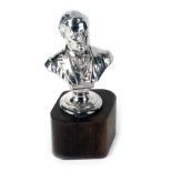 A stainless steel Monarch Walner bust, on an ebony base, 20cm high.