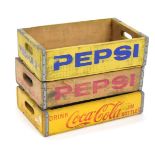 Three painted wooden crates, later painted for Pepsi and Coca Cola, each tray 12cm high, 46cm wide,