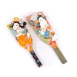 Two Oriental hand fans, each with applied geisha, in raised relief, 46cm and 42cm high. (2)