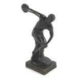 A late Grand Tour style bronze of a discus thrower, on a rectangular base, cast with Greek key desig