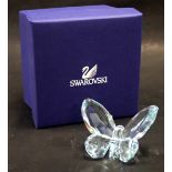 A Swarovski crystal blue butterfly, 6cm wide, boxed.