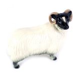 A ceramic model of a ram, unmarked, 17cm high.