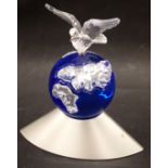 A Swaroski crystal Dove of Peace figure, depicting a dove on blue globe with chrome base, 12cm high.