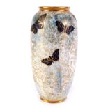 An unusual Royal Doulton porcelain vase, decorated with butterflies, on a gilt, yellow and blue mott